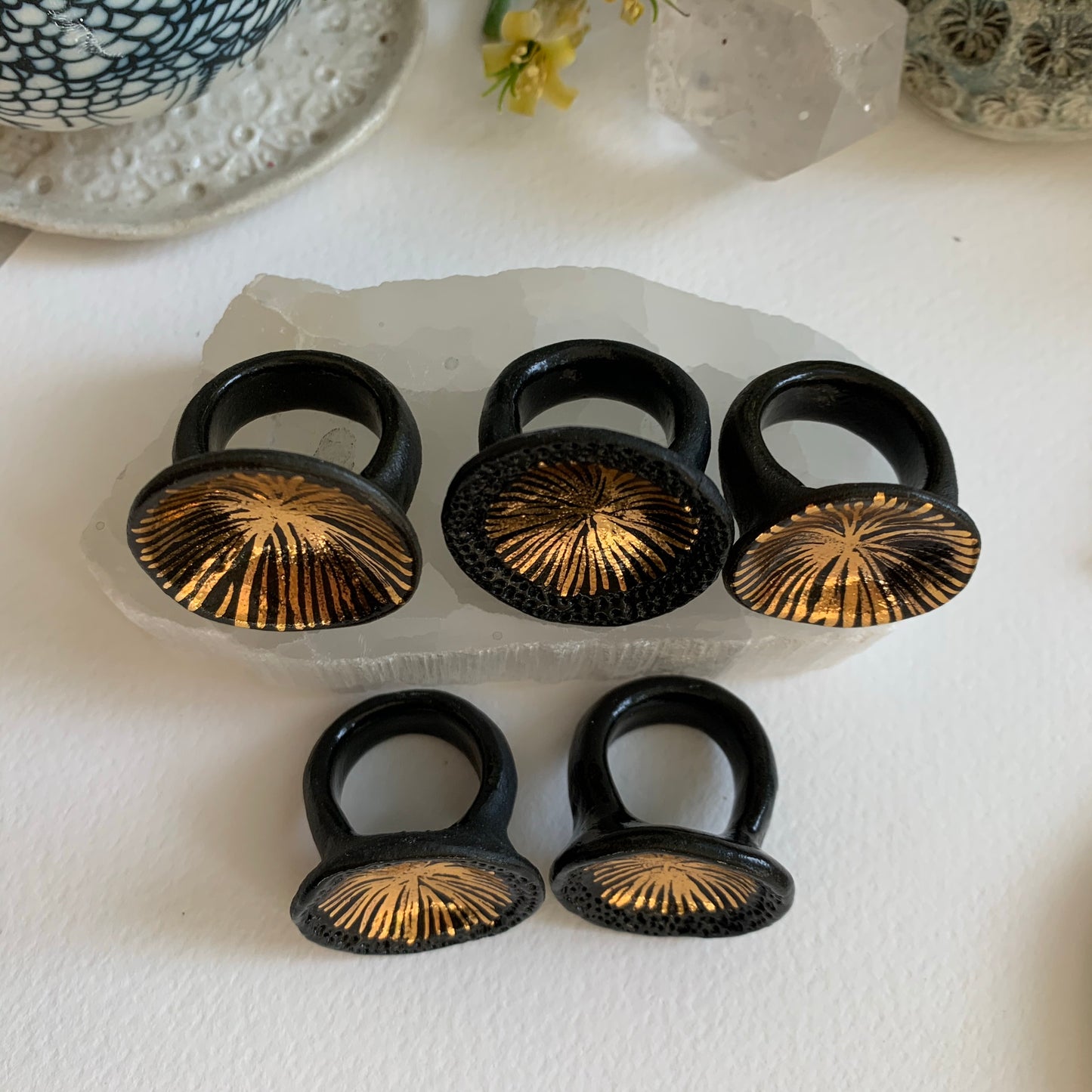 Black and gold lustre ‘Star’ porcelain ring