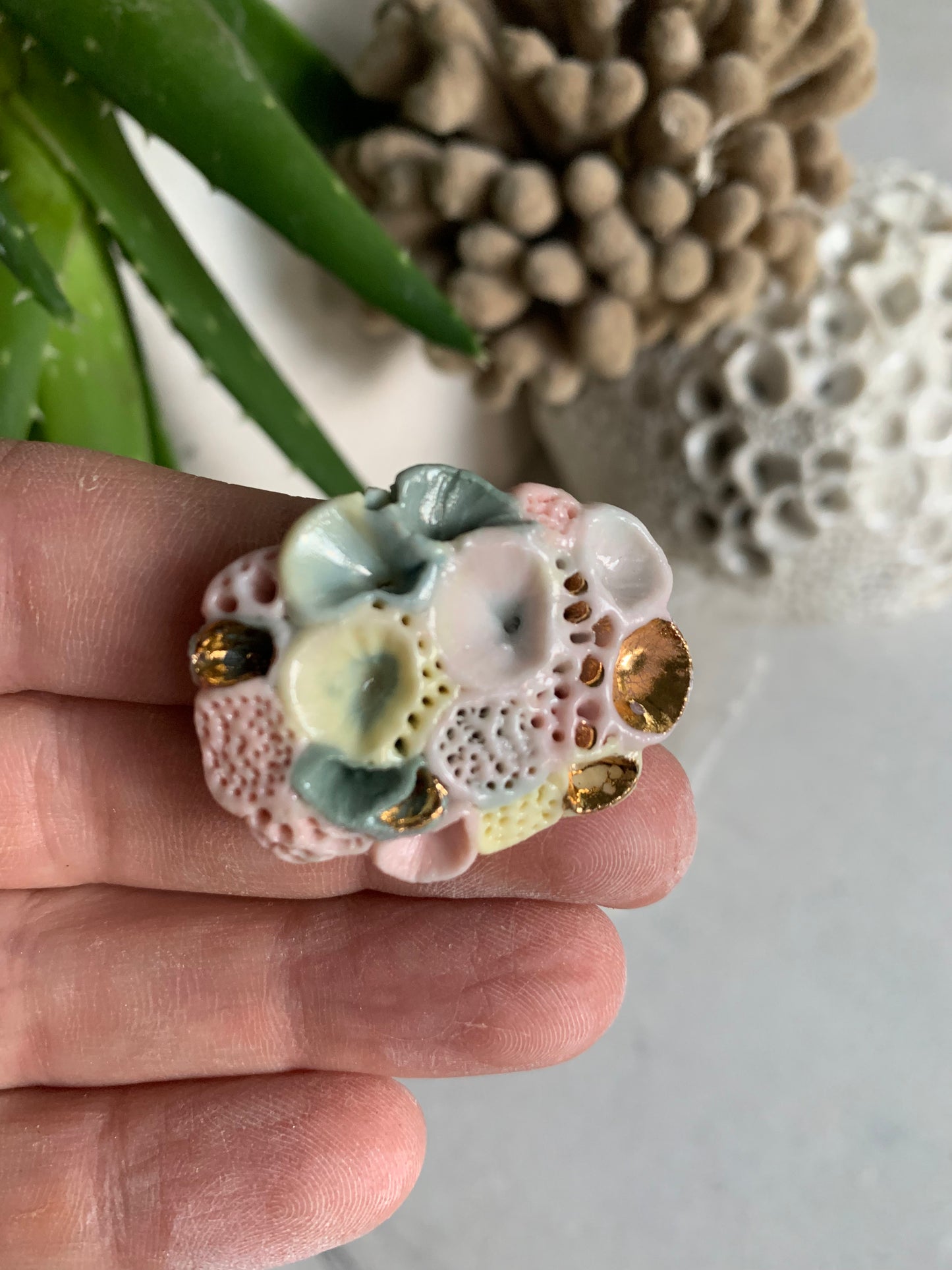 ’Rock coral’ coloured porcelain brooch, choose one