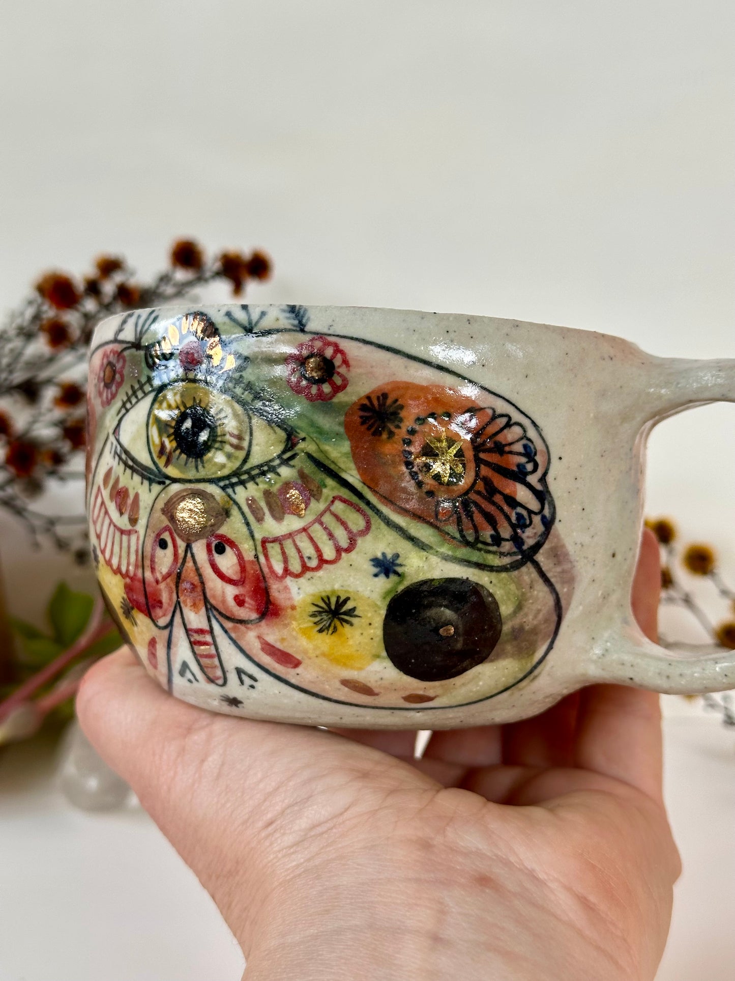 ‘moth’ hand painted cup