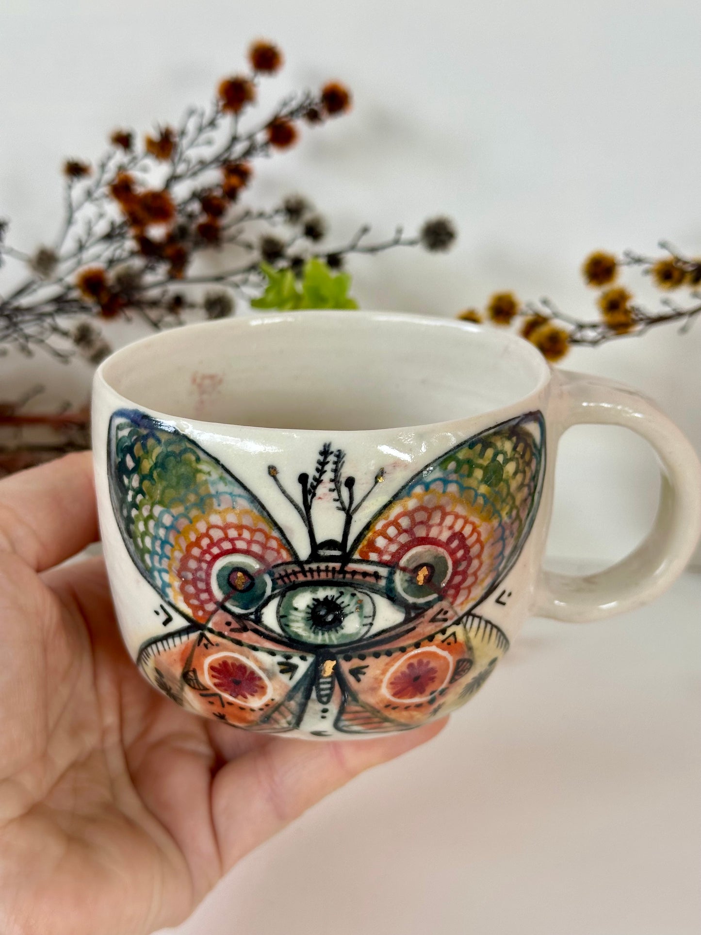 ‘moth’ hand painted cup