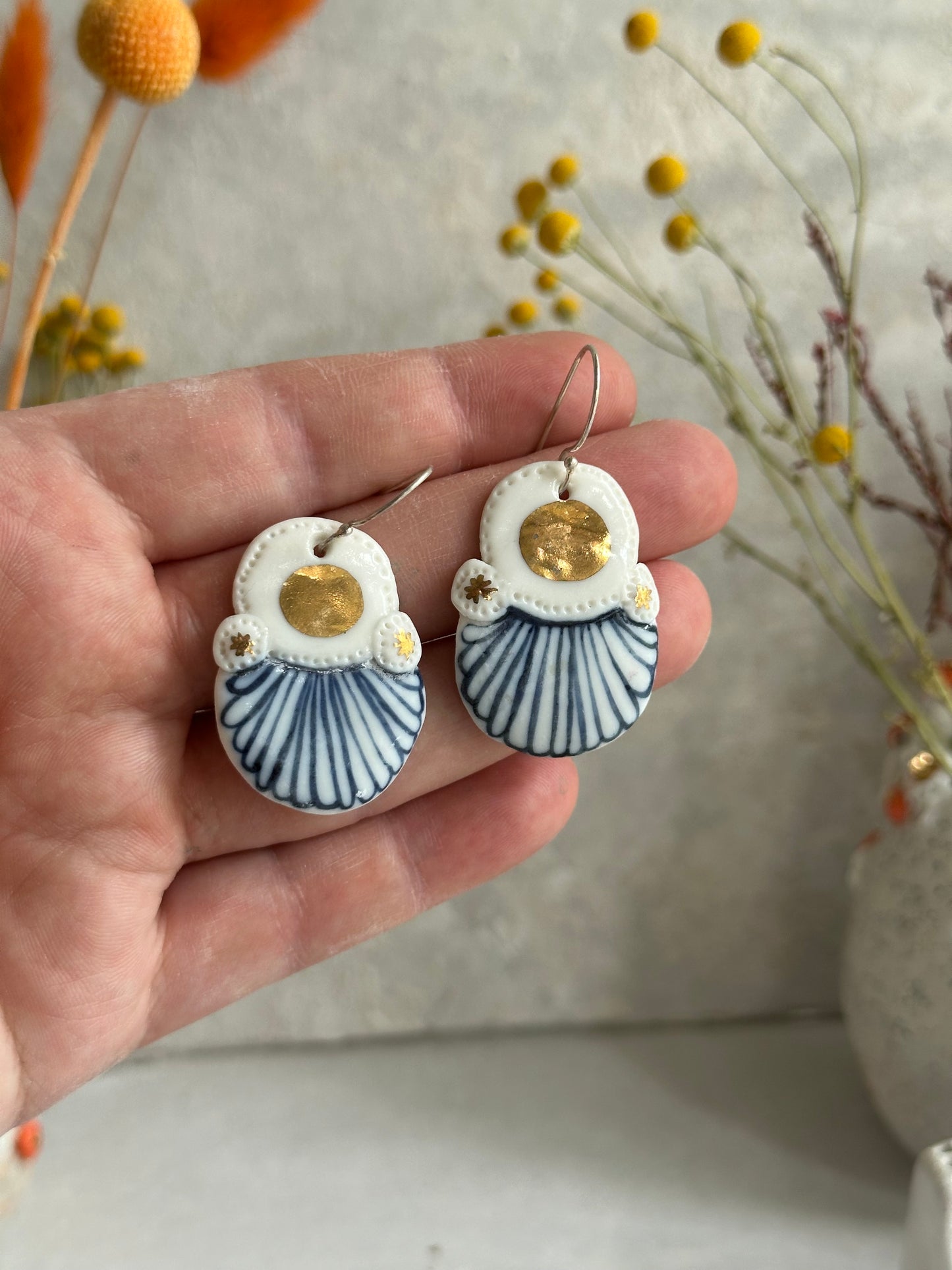 Blue and white hand painted porcelain earrings with gold lustre detail.