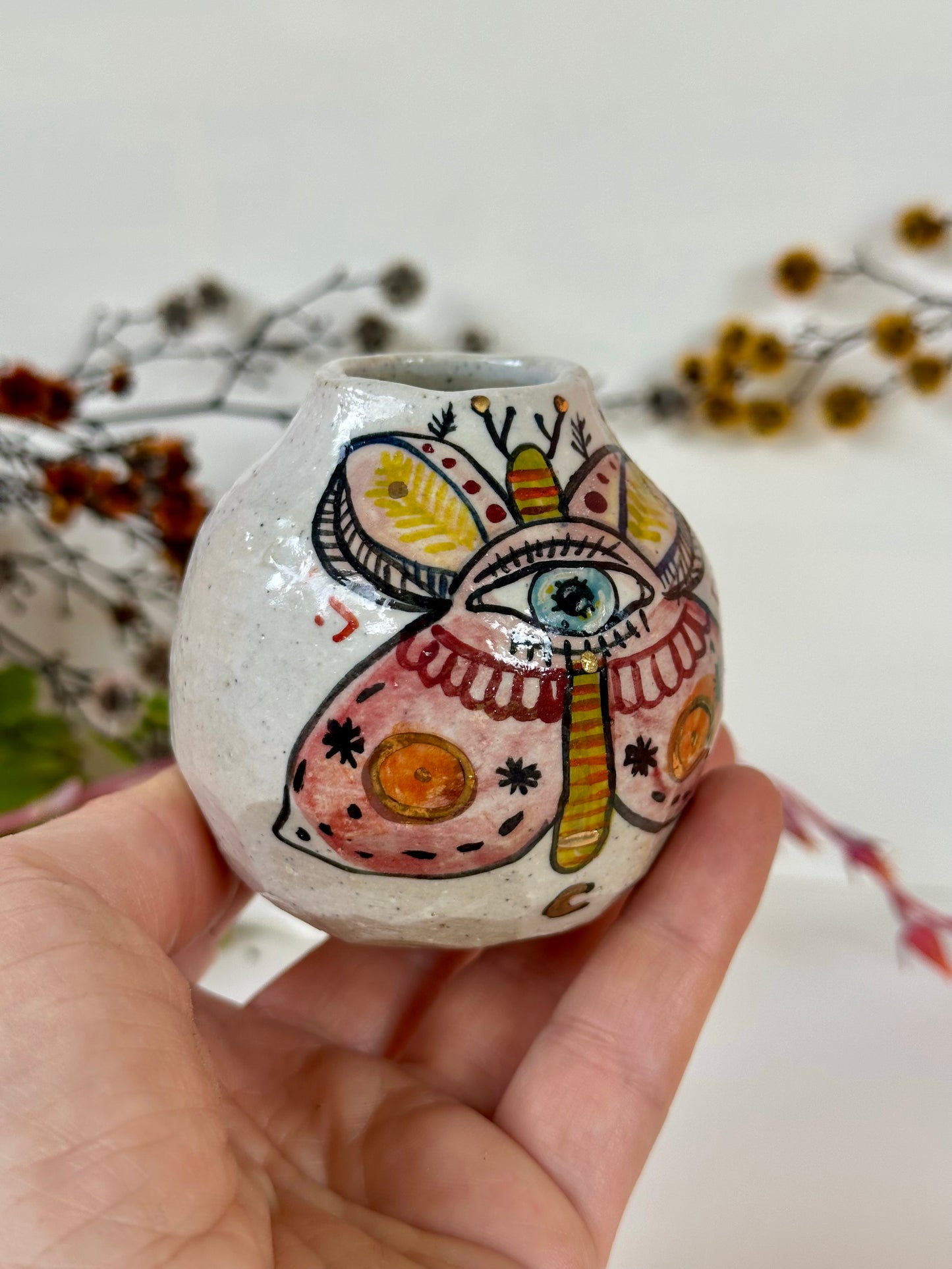 ‘Hand painted ‘the protective eye, moth’ small vase