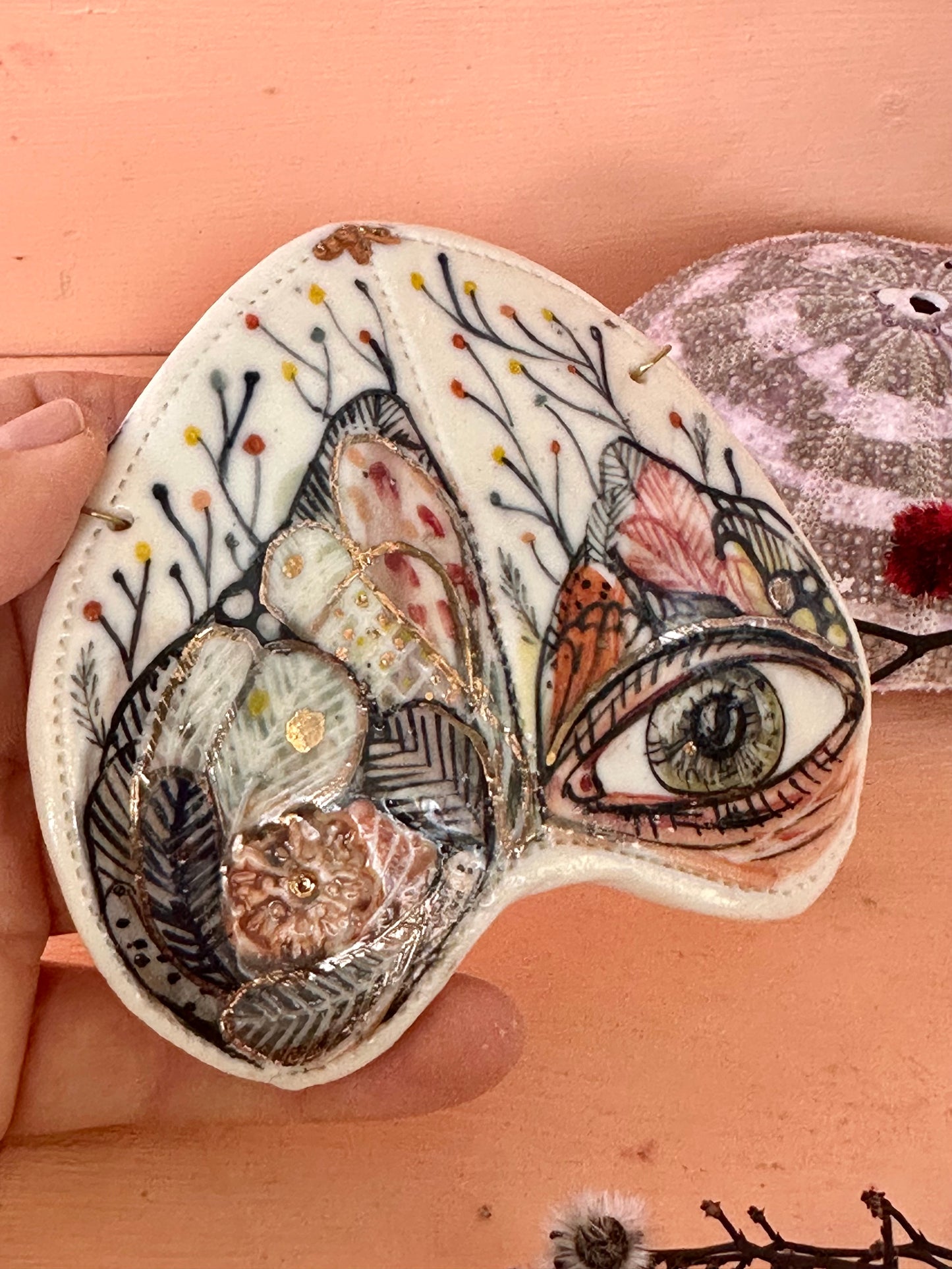 ‘Moth, protective eye’ porcelain wall piece, small gold lustre detail