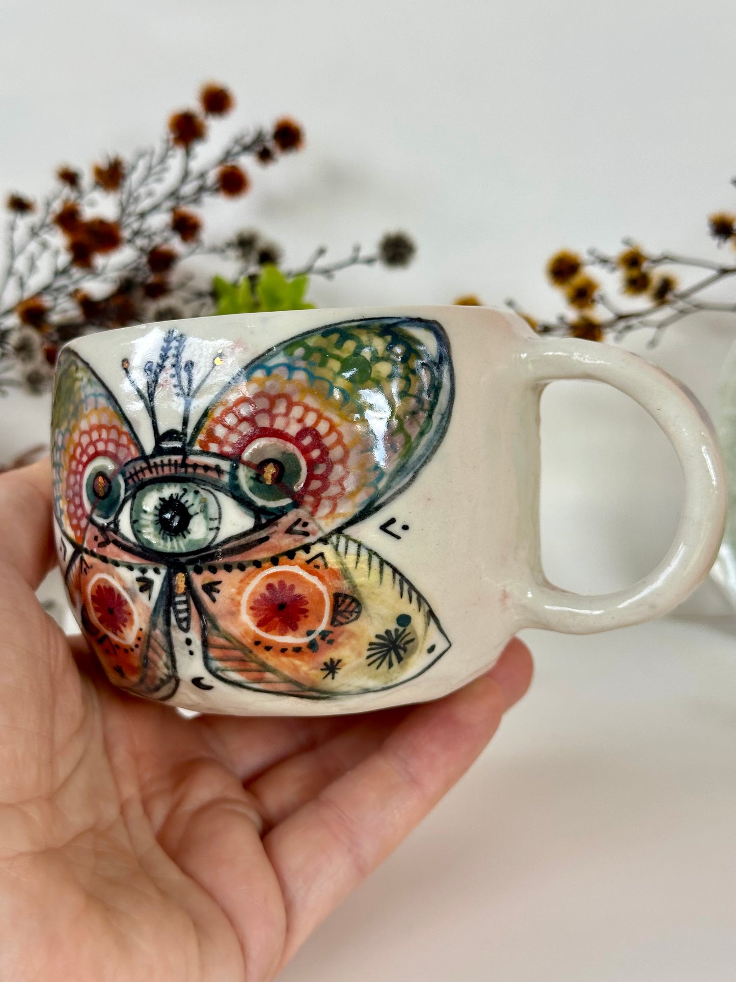 ‘moth’ hand painted cup