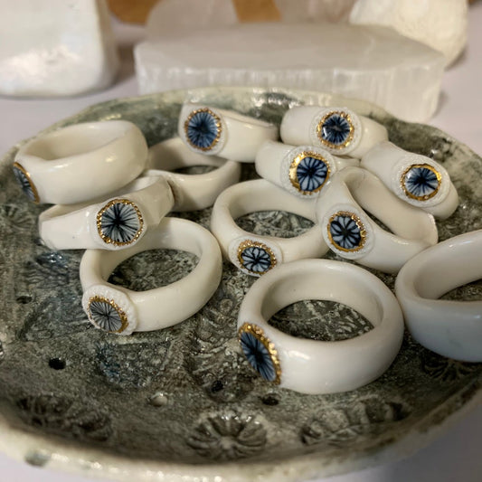 Porcelain band ring with blue star and gold lustre detail. Choose a size