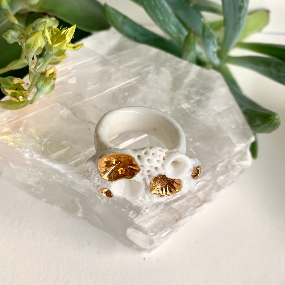 One white and gold ‘rock coral’ porcelain ring