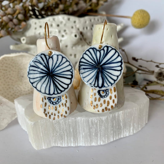 Blue and white hand painted porcelain earrings with gold lustre detail.