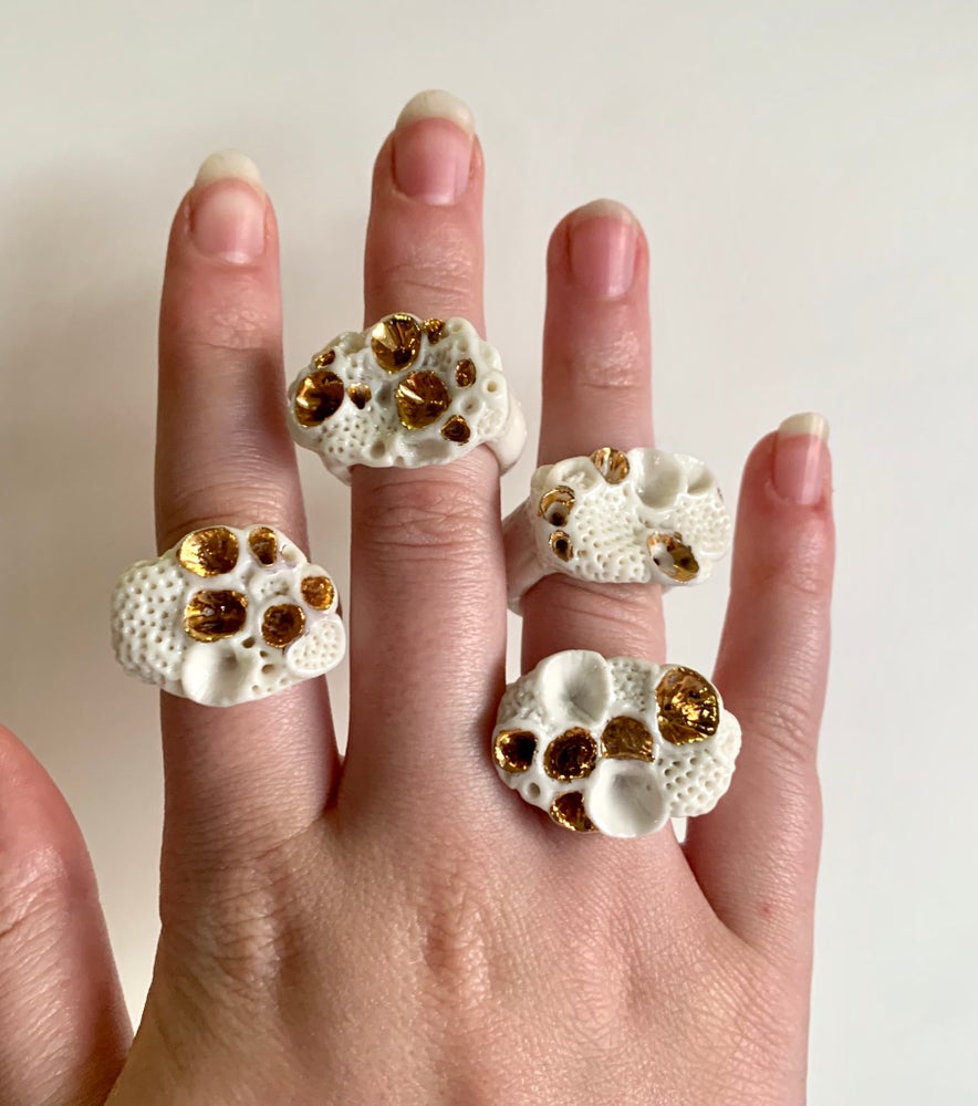 One white and gold ‘rock coral’ porcelain ring