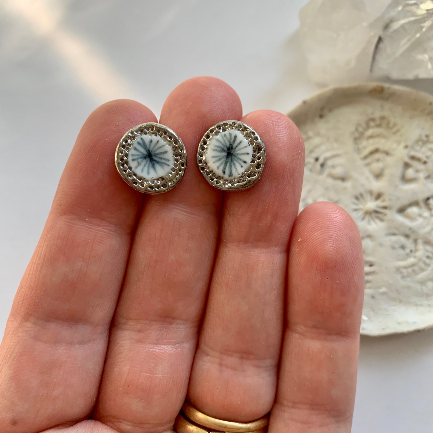 One pair of porcelain studs, blues
