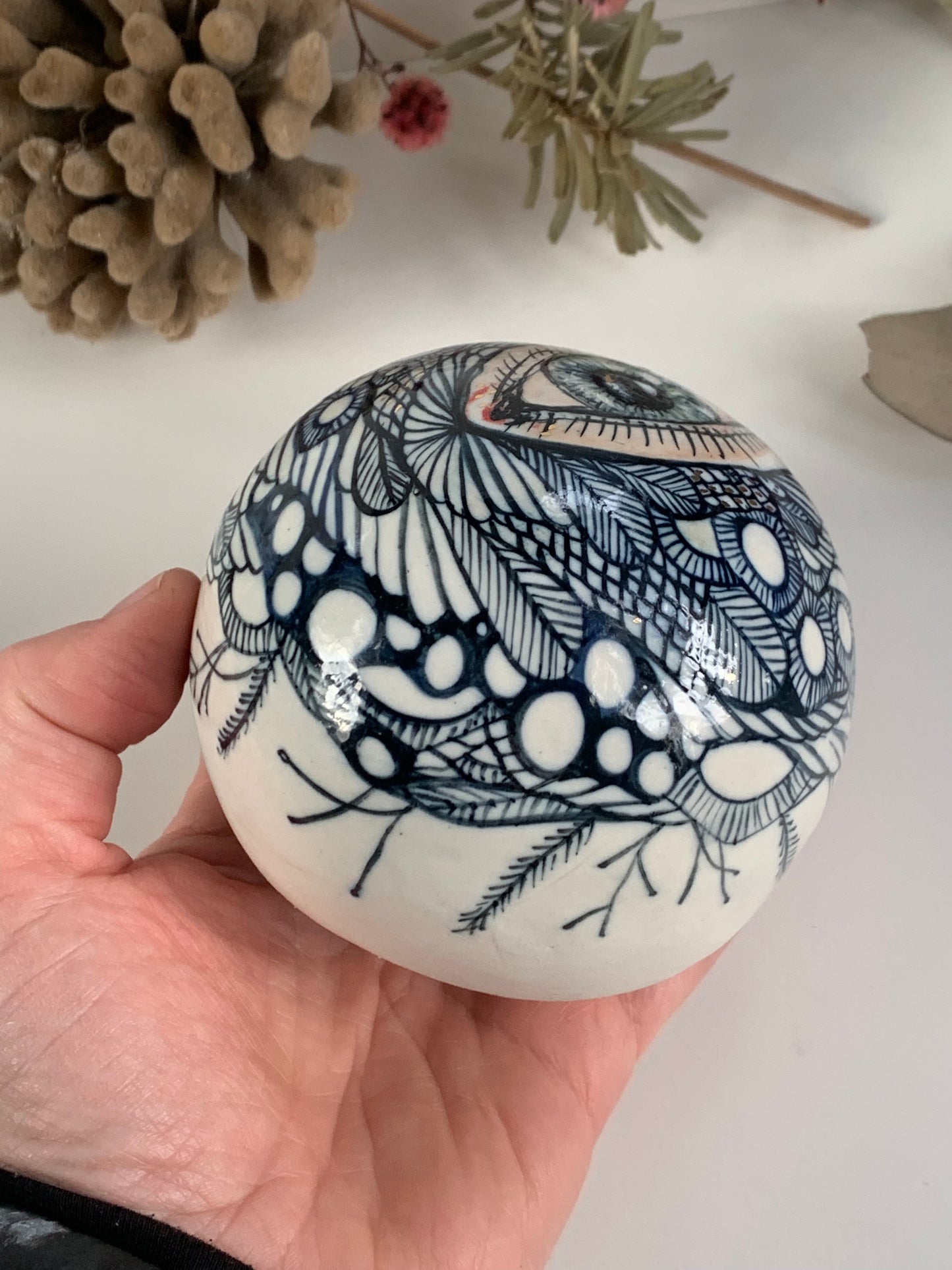 Hand painted porcelain paperweight with gold lustre details