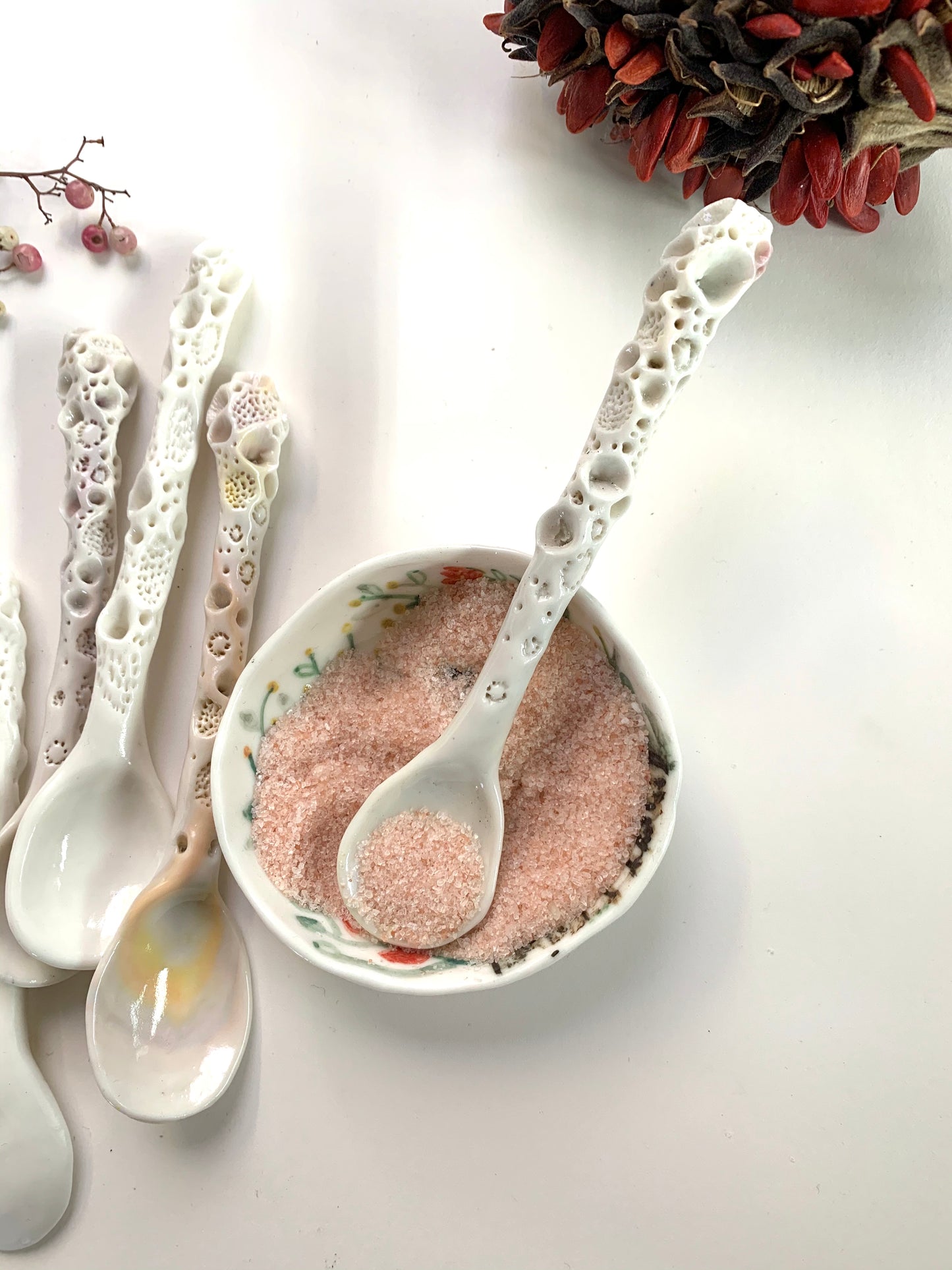 One Porcelain hand formed ‘coral’ spoon