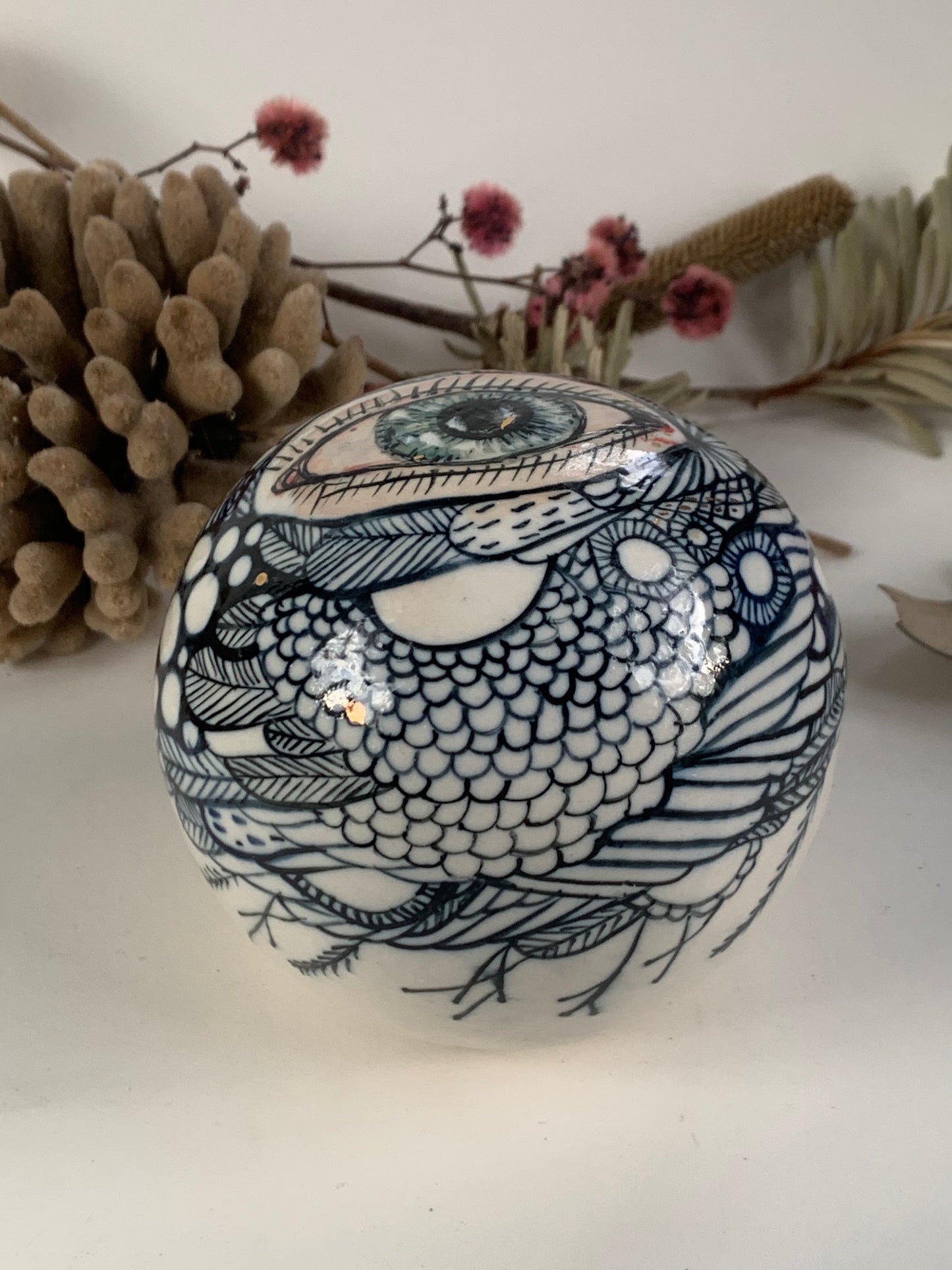 Hand painted porcelain paperweight with gold lustre details
