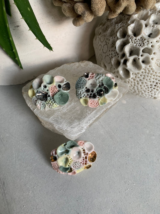 Copy o’Rock coral’ coloured porcelain brooch, choose one